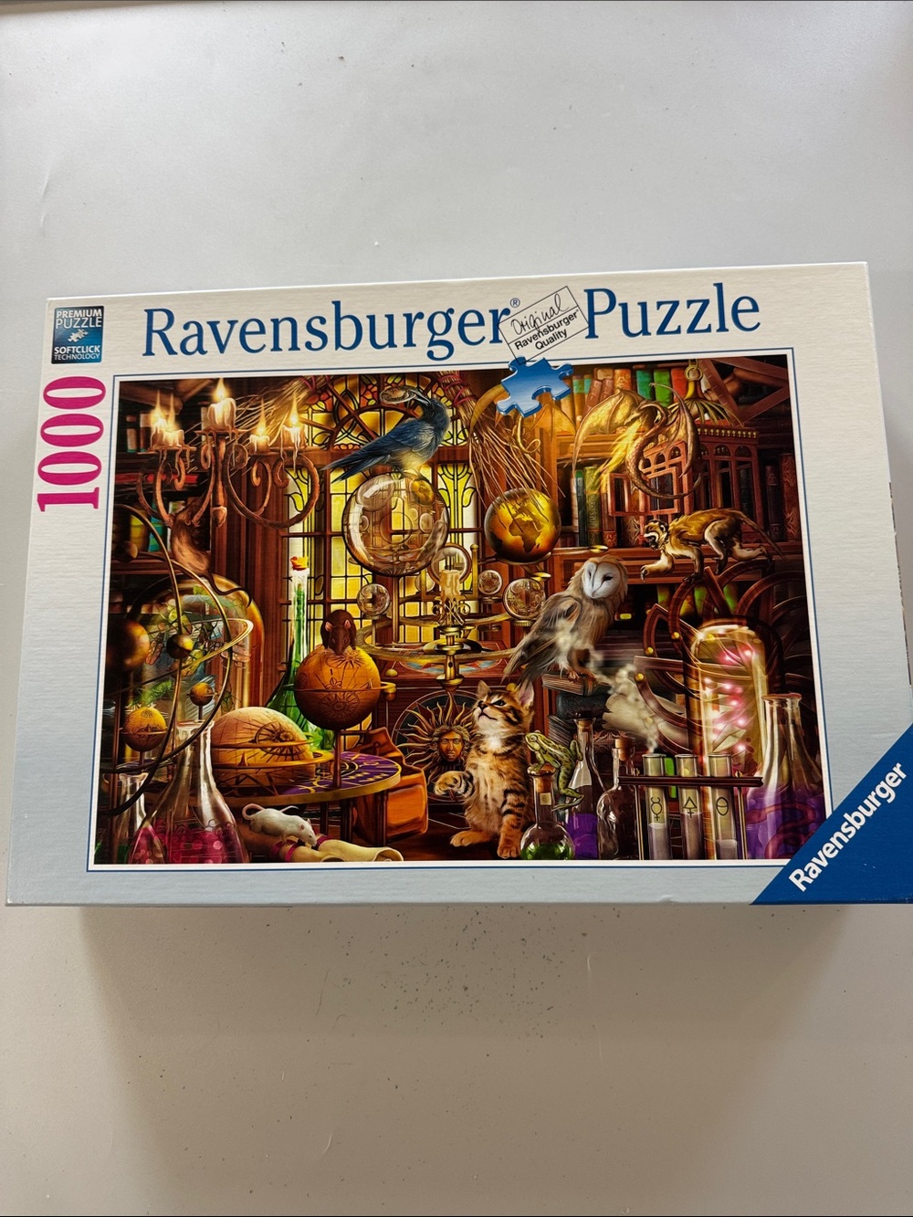 Ravensburger Puzzle with Vibrant Gold, Brown and Blue Magical Study Illustration